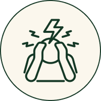 Person overwhelmed with stress or headache, symbolized by lightning bolt and tension marks.